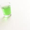 10456   Shot glass of green absinthe