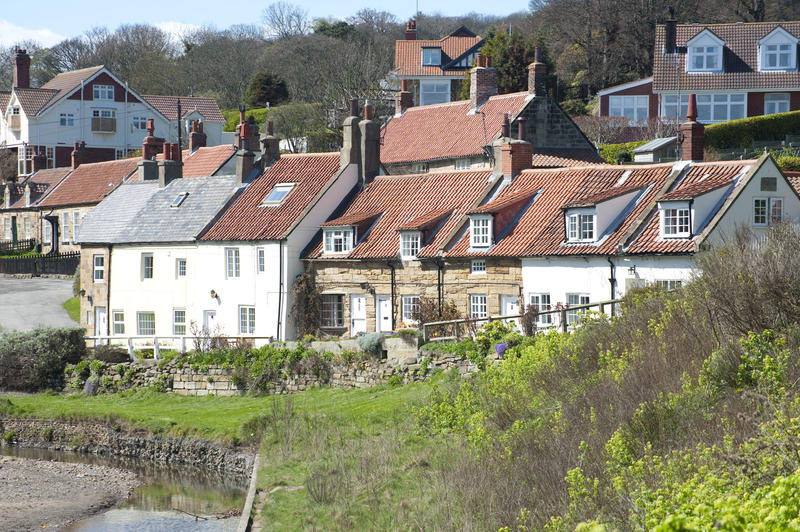 Cottages on a hillside at Sandsend, a small fishing village on the coast close to Whitby in Yorkshire