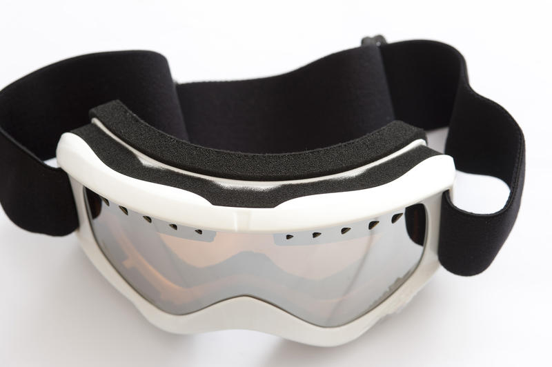 Snowboarding goggles on a white background in a winter sport, vacation and healthy active lifestyle concept
