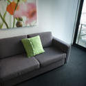 8839   Grey sofa in a small urban apartment