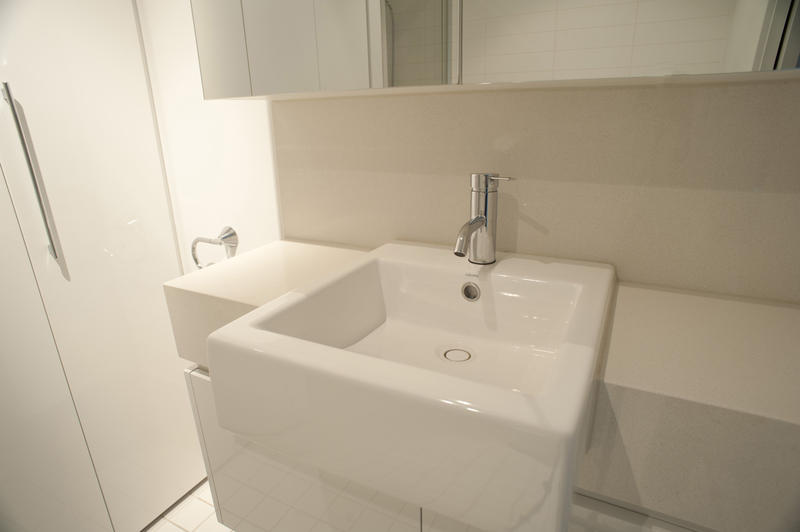 Close up Elegant Architectural White Square Ceramic Sink with Silver Faucet in the Bathroom