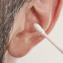 11557   Man Cleaning Ear with Cotton Stick Swab