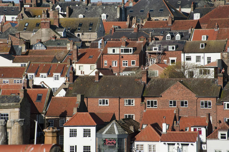 View across the rooftops of typical old traditional English houses and cottages in Whitby in Yorkshire