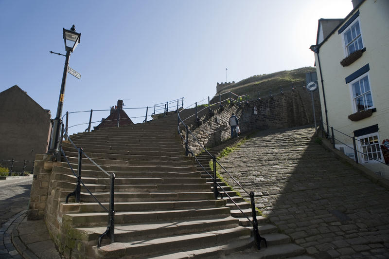 Bottom of the historical 199 Church stairs in Whitby as they leave Church street to wend their way up Tate Hill to St Marys Church