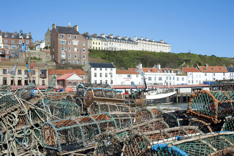 Lobster pots dry in the sun along the quayside in Whitby, North Yorkshire