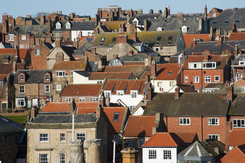 View over the rooftops of Whitby in north Yorkshire showing traditional old historical English architecture