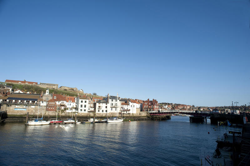 Picturesque view of the swing bridge over the River Esk in Whitby harbour allowing the passage of larger ships from the upper reaches