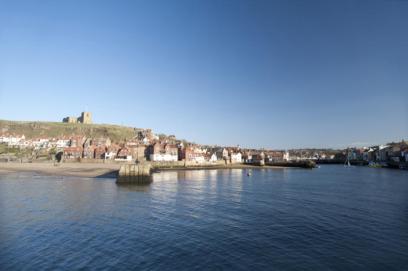 View across the River Esk to Tate Hill and Whitby town with St Marys church perched on the skyline