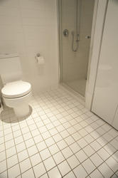 10668   White Tiled Flooring at the Bathroom
