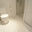 10668   White Tiled Flooring at the Bathroom
