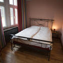 8942   Minimalist bedroom with a hardwood floor