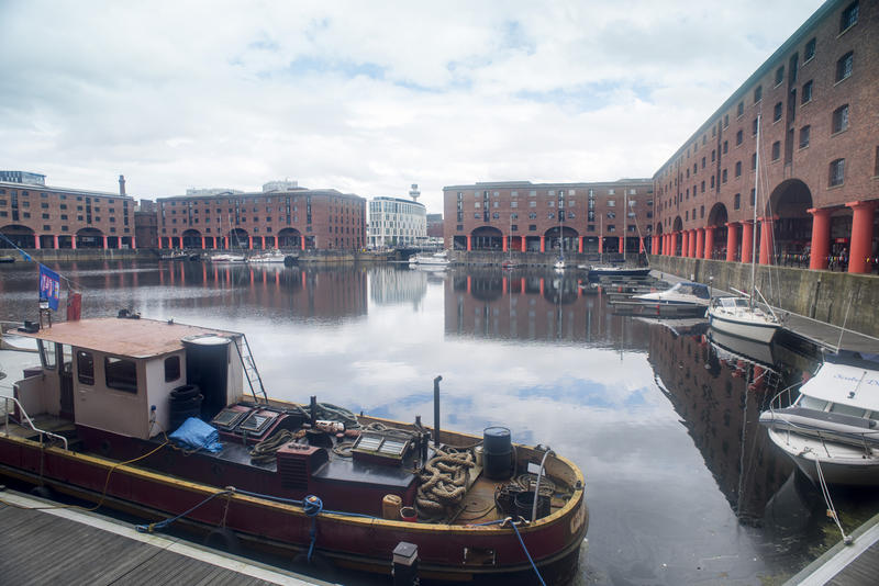 Various types of leisure and commmercial boats docked at Liverpool Albert Dock in the United Kingdom