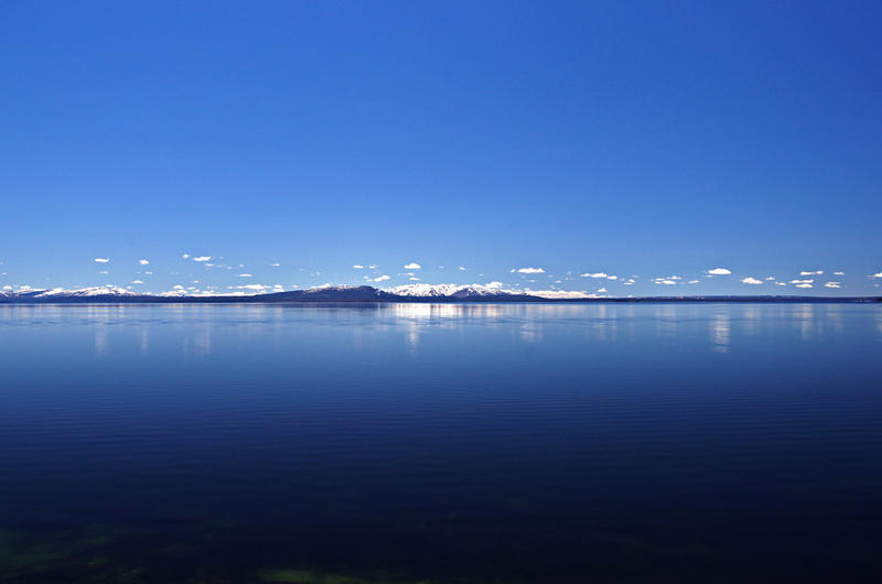 <p>Deep blue skies form over a very blue Yellowstone Lake.&nbsp;&nbsp; In the distance, a chain of mountains bisects this collage of blueness.</p>

<p><a href="http://pinterest.com/michaelkirsh/">http://pinterest.com/michaelkirsh/</a></p>
