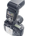 12149   Back view of SLR camera with strobe light