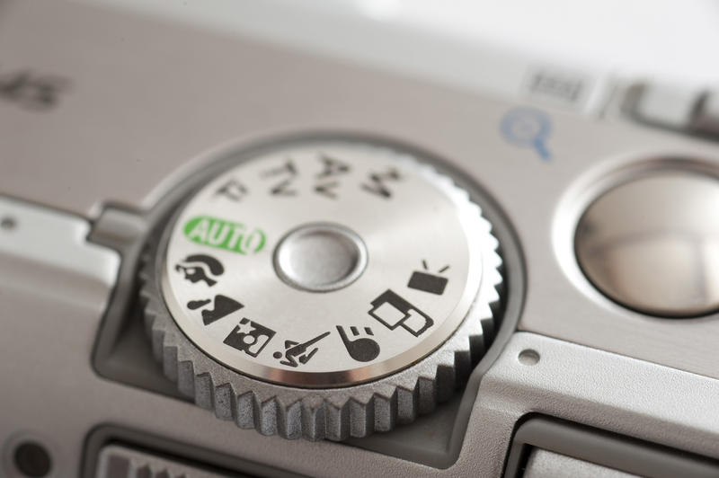 Dial detail on a digital camera with selective focus to the individual program icons