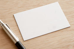 12729   Blank white card with a ball point pen