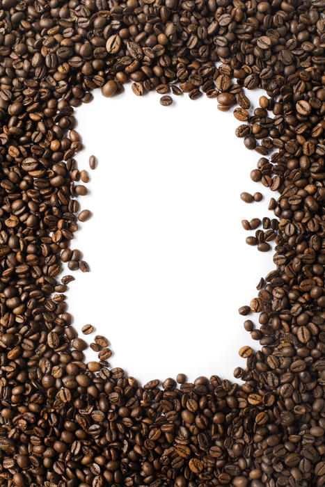 Rectangular frame of medium roasted fresh dried coffee beans over white with central copy space