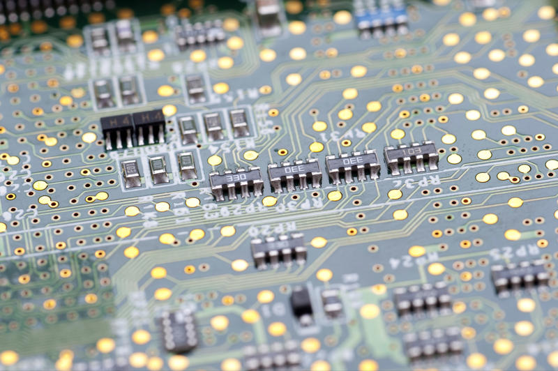 Electronic circuit on green board close-up macro full frame image