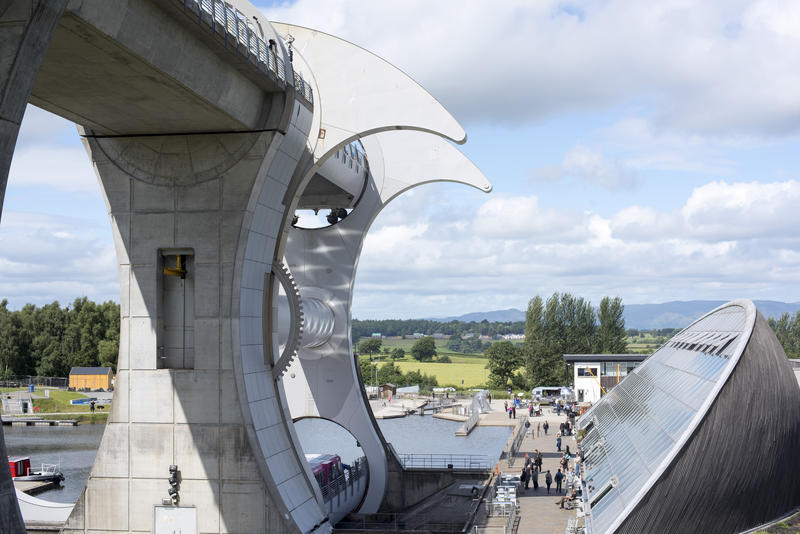 Birds eye view on round building and lift for Falkirk Wheel in Scotland under partly cloudy skies