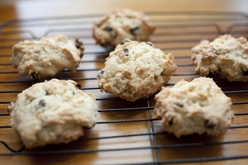 Set of six hot freshly baked crispy rock cake cookies on rack with center in focus