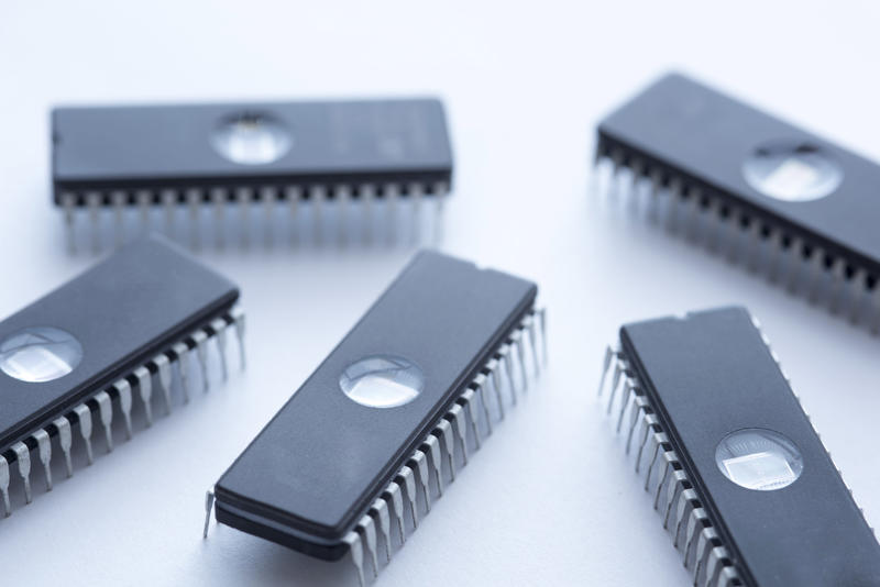 Black integrated circuit memory chips EEPROM on white surface background