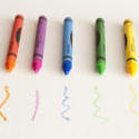 11952   Colorful Crayons Lined Up on Paper with Scribbles