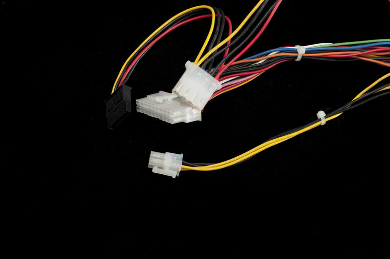 ATX Molex power connector plugs with wires isolated on black background