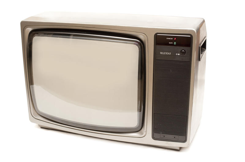 Retro television set with a blank screen viewed at an angle isolated on a white background in an entertainment concept