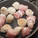 13022   Pigs in blankets ready for cooking in a pan