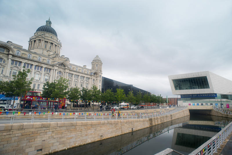 Exterior Architectural View of Royal Liver Building and Museum of Liverpool, Liverpool Waterfront, England, UK on Overcast Day with Cloudy Sky
