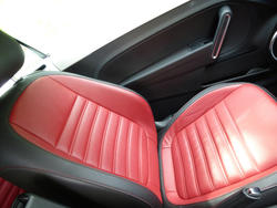 16359   Red leather seat in a modern car