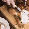 17175   Man slicing a roasted Christmas turkey