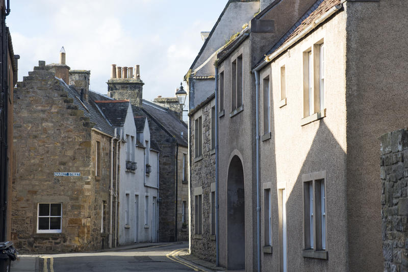 Narrow street with contrasty shadows in the small town of Saint Andrews, Scotland