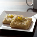 12278   buttered crumpets in square plate by knife