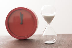 12961   Modern red timer clock with an egg timer