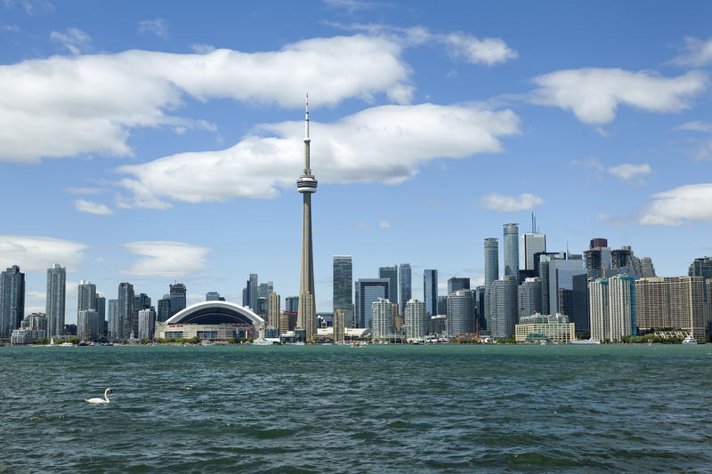 <p>Toronto skyline shot across Lake Ontario and featuring the CN (Canadian National) Tower and the Rogers Stadium.</p>
