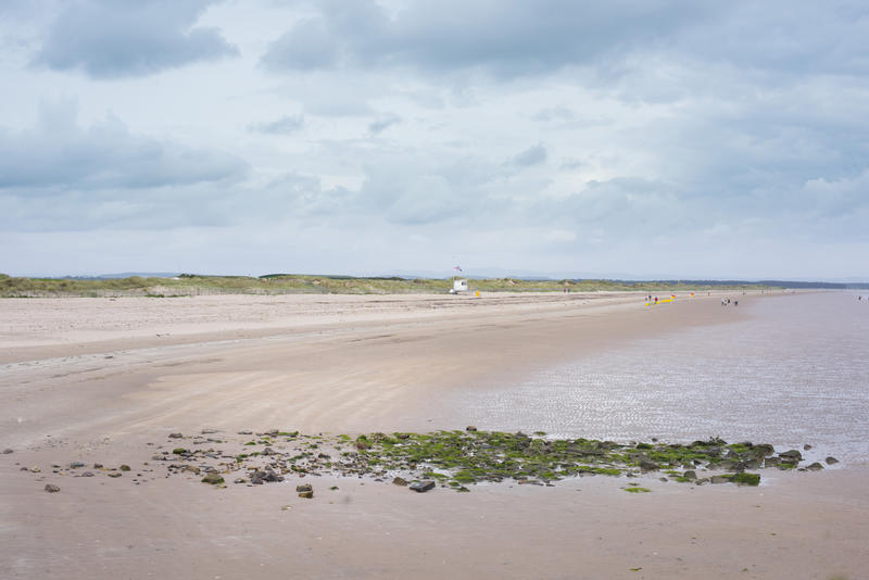 Deserted beach at St Andrews, Scotland on the Fife coast under a grey cloudy sky