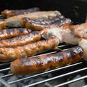 17423   Grilling sausages on a barbecue