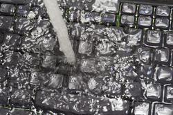 17865   Computer keyboard under running water