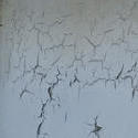 17757   Old peeling cracked white paint on metal panel