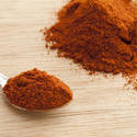 17248   Spoonful of paprika with pile of ground spice