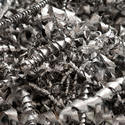 17748   Spirally coiled metal shavings background texture