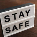 17412   Small Stay Safe sign on a table or floor
